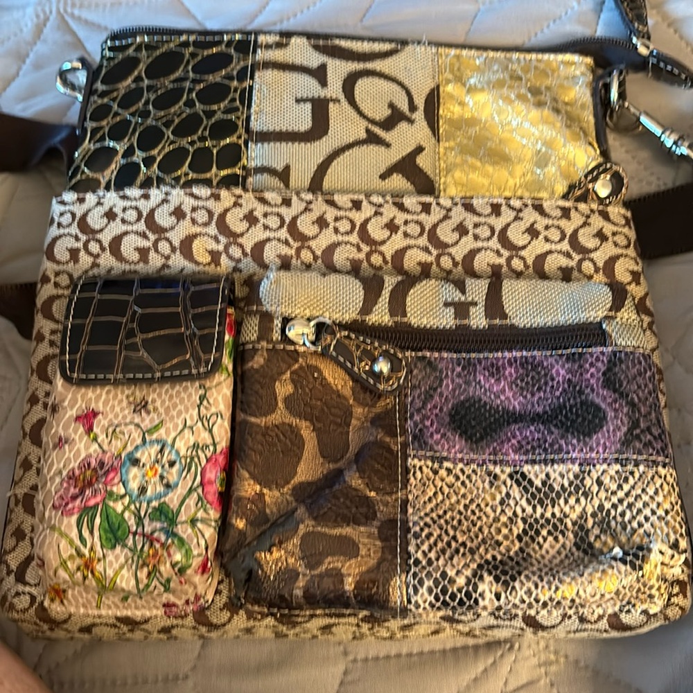 Unnamed brown cross body. Assorted colors and fabric make up both outside purse